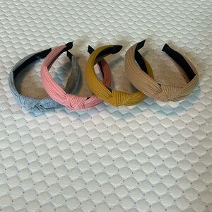 Cute headbands with a knot on top. Pink, grey, mustard, and tan.